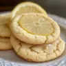 Plate of lemon meltaway cookies with powdered sugar topping