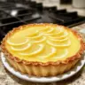 Homemade lemon tart with a golden crust and vibrant lemon filling
