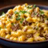 Creamy Loaded Cheeseburger Alfredo Pasta topped with herbs and cheese