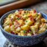 Mustard Horseradish Potato Salad with Bacon and Cheddar in a bowl