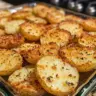 Delicious Parmesan Crusted Potatoes garnished with garlic butter