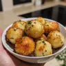 Crispy Parmesan Garlic Potato Balls served on a plate