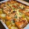 Salmon and Potato Bake served in a dish, garnished with fresh herbs.