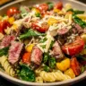Delicious steak pasta salad with fresh ingredients and vibrant colors