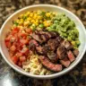 Delicious steak burrito bowls inspired by Chipotle recipe, featuring fresh ingredients.