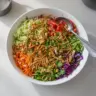 Colorful Asian Chopped Salad with fresh vegetables and sesame dressing