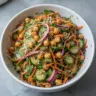 Asian cucumber and chickpea slaw with sesame dressing in a bowl