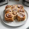 Delicious banana bread cinnamon rolls topped with cream cheese frosting