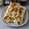 Delicious cheesy garlic chicken wraps with melted cheese and garlic flavor