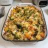 Cheesy Veggie Quinoa Casserole topped with cheese and vegetables, a healthy dish.