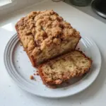 Sliced Cinnamon Crumb Banana Bread with crumbs on top