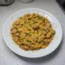 Creamy one pot chicken sausage and rice dish served in a bowl