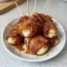 Crispy bacon mozzarella poppers with a sweet maple glaze served on a platter