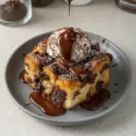 Dark Chocolate Bread Pudding served in a bowl with a scoop of ice cream