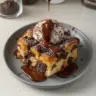 Dark Chocolate Bread Pudding served in a bowl with a scoop of ice cream