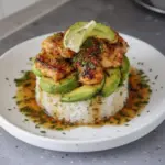 Gluten-free honey lime chicken served with avocado rice stack