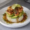 Gluten-free honey lime chicken served with avocado rice stack