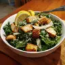 Vegan Lemon Kale Caesar Salad garnished with fresh ingredients