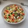 Healthy Mediterranean Couscous Salad with fresh vegetables and herbs