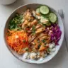 High Protein Buddha Bowl filled with fresh veggies, grains, and legumes