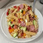 High Protein Italian Pasta Salad with vegetables and herbs in a bowl