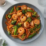 High-protein one-pan shrimp stir fry with colorful vegetables and seasonings