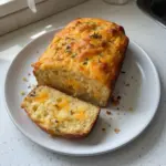Irresistibly Easy Cheddar Cheese Quick Bread with melted cheese and herbs