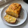 Irresistibly Easy Cheddar Cheese Quick Bread with melted cheese and herbs