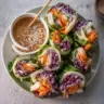 Delicious homemade Keto Spring Rolls with fresh vegetables and dipping sauce