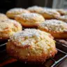 Freshly baked Lemon Cornmeal Cookies on a cooling rack.