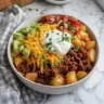 Delicious Loaded Potato Taco Bowl with toppings and ingredients