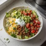 Low carb burrito bowl with fresh vegetables and toppings