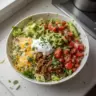 Low carb burrito bowl with fresh vegetables and toppings