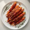 Maple Bacon Carrots dish featuring sweet glazed carrots with crispy bacon bits.