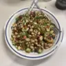 Colorful Mediterranean Bean Salad with fresh vegetables and herbs
