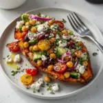 Mediterranean stuffed sweet potatoes filled with vibrant vegetables and herbs