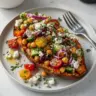 Mediterranean stuffed sweet potatoes filled with vibrant vegetables and herbs