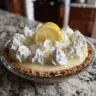 No Bake Lemon Pie topped with whipped cream and lemon slices