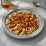One-Pan Honey BBQ Chicken with Rice dish, showcasing juicy chicken and flavorful sauce.