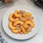 Peach Bellini mocktail made with fresh peaches and sparkling water.