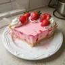 Delicious Strawberry Cream Cheese Jello Pie topped with fresh strawberries