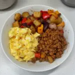 Delicious Tex-Mex Protein Breakfast Bowls filled with eggs, beans, and fresh toppings.