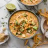 Creamy white chicken chili in a bowl with toppings