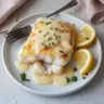 Delicious baked cod with mayo and parmesan served on a plate