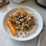 Baklava overnight oats topped with nuts and honey in a bowl
