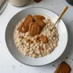 Biscoff overnight oats topped with biscoff spread and chocolate chips