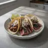 Blackened Seared Tuna Tacos topped with fresh ingredients