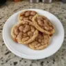 Brown Sugar Cinnamon Caramel Cookies on a plate with a sprinkle of cinnamon
