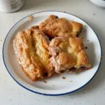 Delicious homemade buttermilk bars with frosting on a plate