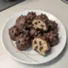 Delicious chocolate chip cookie dough truffles on a wooden table.